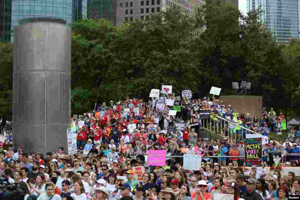 People gather to walk with the &quot;March for Our Lives&quot; demonstration in Houston.
