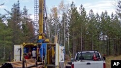 FILE - A prospecting drill rig bores into the bedrock near Ely, Minn., in search of copper, nickel and precious metals that Twin Metals Minnesota LLC, hopes to mine near the Boundary Waters Canoe Area Wilderness in northeastern Minnesota, Oct. 4, 2011.