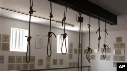 In this photo taken Thursday, Dec 8. 2011, nooses hang in the gallows at the Pretoria Central Prison. The gallows now serve as a monument to those who were executed before executions were stopped in 1989 