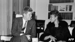 President John Kennedy chats in his White House office with Wilma Rudolph in 1961, the year after she won three gold medals at the Olympic Games in Rome 