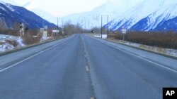 FILE - Seward Highway near Portage, Alaska. The Great Alaska Earthquake on March 27, 1964, opened fissures on the highway at the head of Turnagain Arm and destroying nearby bridges and railroad tracks.