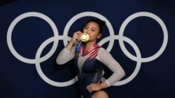 Sunisa Lee, of United States, reacts as she poses for a picture after winning the gold medal in the artistic gymnastics women's all-around final at the 2020 Summer Olympics, Thursday, July 29, 2021, in Tokyo, Japan.