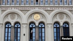 FILE - A dove of peace flies from the window of the Nobel Peace Center in connection with the announcement of the 2023 Nobel Peace Prize winner in Oslo, Norway, October 6, 2023.