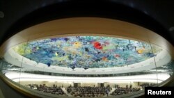 FILE - A fisheye view of the session of the Human Rights Council during a speech by U.N. High Commissioner for Human Rights Michelle Bachelet at the United Nations in Geneva, Switzerland, Feb. 27, 2020.