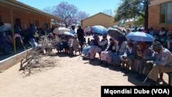 Voters queue outside a polling station in Thamaga, Botswana, west of Gaborone, on Oct. 30, 2024.