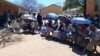 Voters queue outside a polling station in Thamaga, Botswana, west of Gaborone, on Oct. 30, 2024.