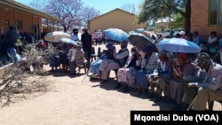 Voters queue outside a polling station in Thamaga, Botswana, west of Gaborone, on Oct. 30, 2024.