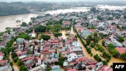 This aerial picture shows flooded streets and buildings after Super Typhoon Yagi hit northern Vietnam, in Yen Bai on Septe.9, 2024.