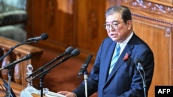 FILE - Japan's new Prime Minister Shigeru Ishiba delivers his inaugural policy address in the lower house of parliament in Tokyo, Oct. 4, 2024.