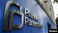 FILE - A sign is pictured at the entrance to a Planned Parenthood building, Aug. 31, 2015. 