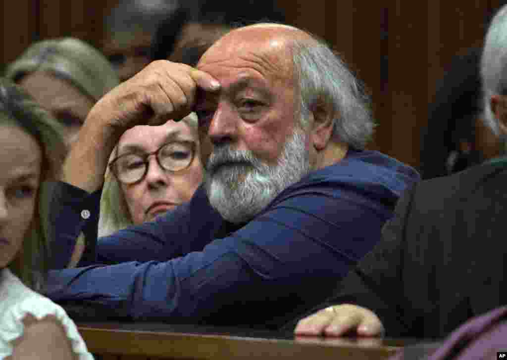 Parents of the late Reeva Steenkamp attend court on the third day of sentencing for Oscar Pistorius at the high court in Pretoria, South Africa, Oct. 15, 2014. 