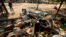 Destroyed furniture and belongings are seen in a market in Sit Kwin, Burma, Mar. 29, 2013. 