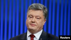 FILE - Ukrainian President Petro Poroshenko, pictured at a news conference in Kyiv in January 2016, says release of the IMF funds will help keep the hryvnia currency stable and aid his nation's economy.