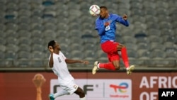 FILE - Namibia's defender Ivan Kamberipa heads the ball away from Kenya's midfielder Duke Abuya during the 2025 Africa Cup of Nations Group J qualifier match between Namibia and Kenya, at Orlando Stadium in Soweto, South Africa, Sept. 10, 2024.