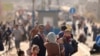 Palestinian families flee Gaza City and other parts of northern Gaza towards the southern areas, walking along a highway on November 9, 2023, amid the ongoing battles between Israel and the Palestinian Islamist group Hamas.