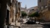 A view of destroyed buildings and cars after the street was controlled by forces loyal to Libyan commander Khalifa Haftar in Derna, Libya, June 13, 2018. 