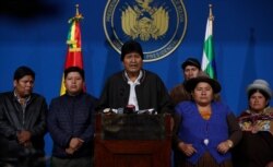 Bolivia's President Evo Morales, center, speaks during a press conference at the military base in El Alto, Bolivia, Nov. 10, 2019.