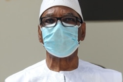 FILE - Mali President Ibrahim Boubacar Keita wears a face mask during the G5 Sahel summit in Nouakchott, Mauritania.