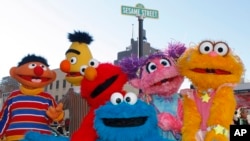 FILE - Characters from Sesame Street Live appear on the street by Madison Square Garden to celebrate the 30th anniversary of the live touring stage shows based on the PBS television series in New York, Thursday, Feb. 4, 2010.