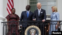 U.S. President Joe Biden, first lady Jill Biden, Kenyan President William Ruto and first lady Rachel Ruto look on from the balcony during an official White House State Arrival ceremony on the South Lawn of the White House in Washington, U.S., May 23, 2024.