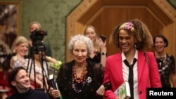 Margaret Atwood and Bernardine Evaristo jointly win the Booker Prize for Fiction 2019 at the Guildhall in London, Britain, Oct. 14, 2019.