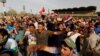 Followers of Iraqi Shi'ite cleric Moqtada al-Sadr shout slogans at Grand Festivities Square within the Green (International) Zone in Baghdad, Iraq, May 1, 2016.