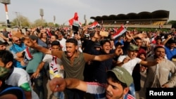 Followers of Iraqi Shi'ite cleric Moqtada al-Sadr shout slogans at Grand Festivities Square within the Green (International) Zone in Baghdad, Iraq, May 1, 2016.