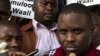 FILE - Kampala Lord Mayor Erias Lukwago (R) address the media outside the Buganda Magistrates court, Uganda.