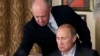 Yevgeny Prigozhin e Vladimir Putin (Foto de Arquivo)