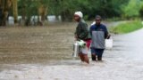 Residents affected after a seasonal river burst its banks following heavy rainfall in Kitengela municipality of Kajiado County