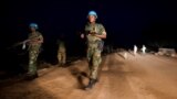 Peacekeeper troops from Ethiopia and deployed in the United Nations (UN) Interim Security Force for Abyei (UNISFA) patrol at night in Abyei town, Abyei state, on December 14, 2016.