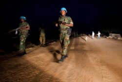 FILE - Peacekeeper troops from Ethiopia in the U.N. Interim Security Force for Abyei (UNISFA) patrol at night in Abyei town, Abyei state, Dec. 14, 2016.