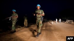 FILE - Peacekeeper troops from Ethiopia in the U.N. Interim Security Force for Abyei (UNISFA) patrol at night in Abyei town, Abyei state, Dec. 14, 2016.