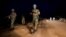 Peacekeeper troops from Ethiopia and deployed in the United Nations (UN) Interim Security Force for Abyei (UNISFA) patrol at night in Abyei town, Abyei state, on December 14, 2016.