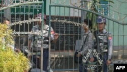 Armed Police at the entrance of a school at Sittwe City, Myanmar