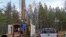 FILE - A prospecting drill rig bores into the bedrock near Ely, Minn., in search of copper, nickel and precious metals that Twin Metals Minnesota LLC, hopes to mine near the Boundary Waters Canoe Area Wilderness in northeastern Minnesota, Oct. 4, 2011.