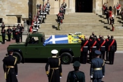 A hearse, a specially modified Land Rover, carrying the coffin of Britain's Prince Philip, is seen on the grounds of Windsor Castle, in Windsor, Britain, April 17, 2021.
