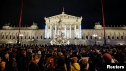 People attend a protest against the Freedom Party after general elections in Vienna, Austria, Oct. 3, 2024. 