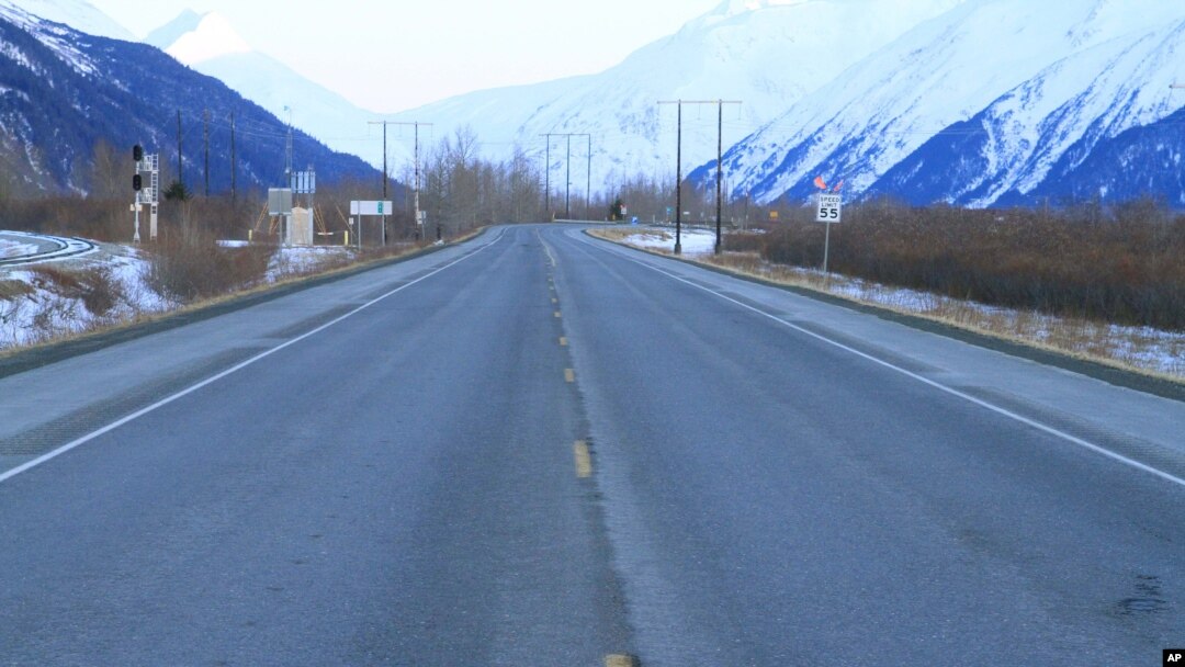FILE - Seward Highway near Portage, Alaska. The Great Alaska Earthquake on March 27, 1964, opened fissures on the highway at the head of Turnagain Arm and destroying nearby bridges and railroad tracks.