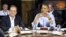 French President Francois Hollande, left, listens as U.S. President Barack Obama speaks at the start of the first working session of the G8 Summit at Camp David, Md., May 19, 2012. 