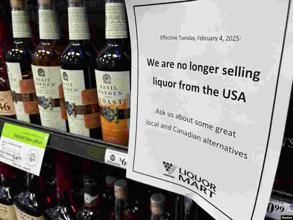 A sign notifying customers that the store will stop selling U.S. liquor effective Feb. 4, in response to U.S. President Donald Trump&#39;s imposition of tariffs on Canada, is displayed on a shelf carrying U.S. alcohol in Winnipeg, Manitoba, Canada, Feb. 2, 2025.