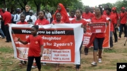 People march during a protest calling on the government to rescue the kidnapped girls of the government secondary school who were abducted two years ago, in Abuja, Nigeria, April 14, 2016.