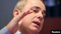 Yuval Steinitz speaks during an interview in New York, Jan. 28, 2013 file photo.