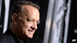 FILE - Actor Tom Hanks arrives at a film screening in Beverly Hills, California, Sept. 30, 2013. 