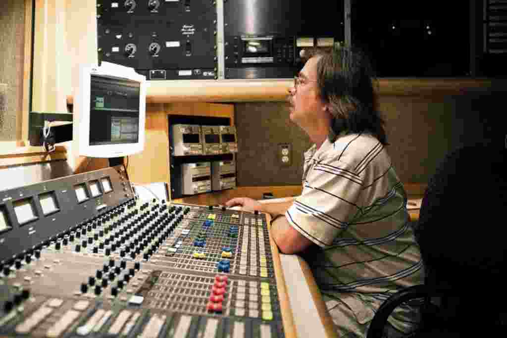 A radio technician inside one of the control rooms.