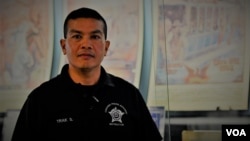 A Thai-American Chicago PD Academy instructor , Officer Trak Silapaduriyang .