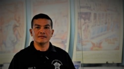 A Thai-American Chicago PD Academy instructor , Officer Trak Silapaduriyang .