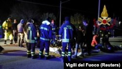 Emergency personnel attend to victims of a stampede at a nightclub in Corinaldo, near Ancona, Italy, in this undated handout picture obtained by Reuters, Dec. 8, 2018. 