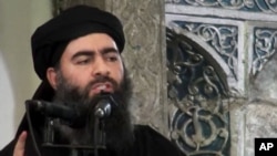 FILE - Image taken a from video shows a man purported to be Abu Bakr al-Baghdadi, senior leader of the Islamic State militant group.