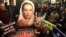 FILE - Supporters of Pakistan's slain leader Benazir Bhutto take part in a memorial in Lahore, Pakistan, Dec. 27, 2015.